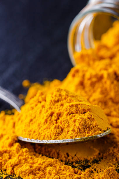 istock natural turmeric powder on a dark stone background 1211312646