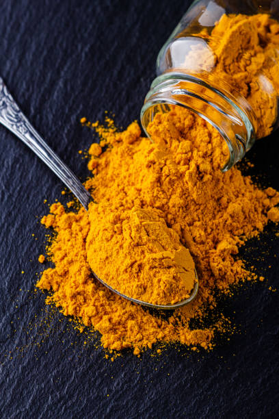 istock natural turmeric powder on a dark stone background 1211312711