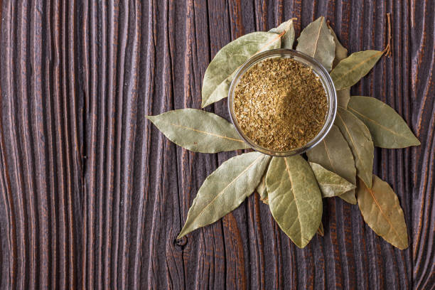 istock ground dried bay leaf on dark wooden rustic background 1211313113