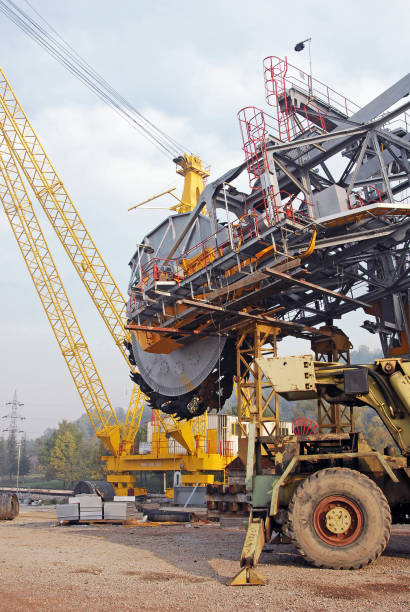 istock Huge excavator on the mounting plot. Construction of a large bucket wheel excavator. Large construction cranes. 1211314765