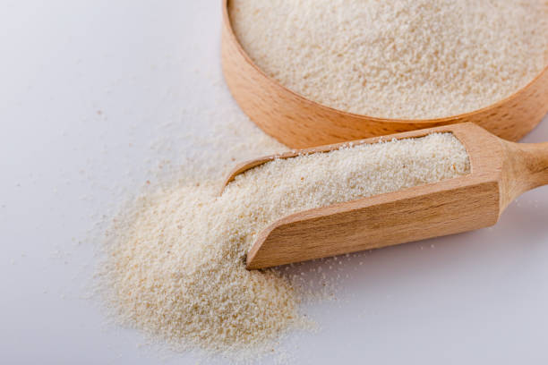 istock natural organic semolina on white acrylic background 1211319335