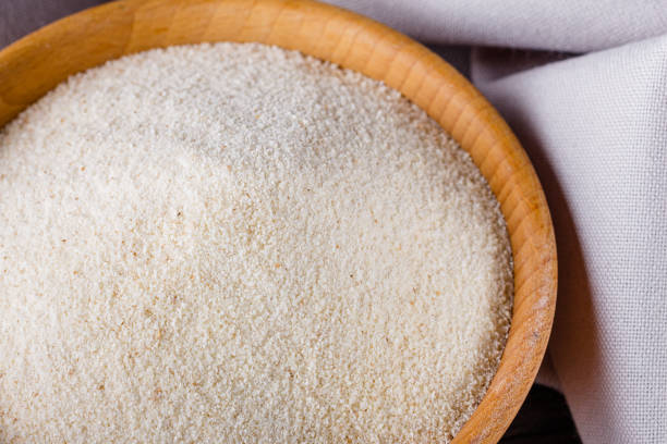 istock natural organic semolina on dark wooden rustic background 1211319492
