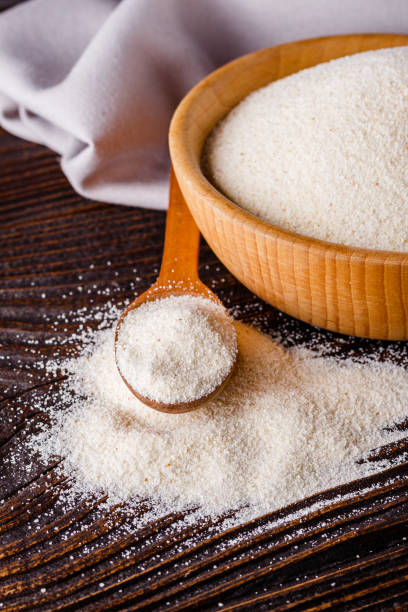 istock natural organic semolina on dark wooden rustic background 1211319594