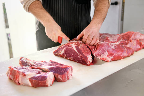 istock Butcher or cook slicing chuck steaks 1211320300