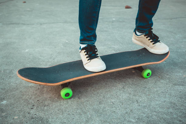 istock Skateboard legs skateboarding at skatepark 1211321328