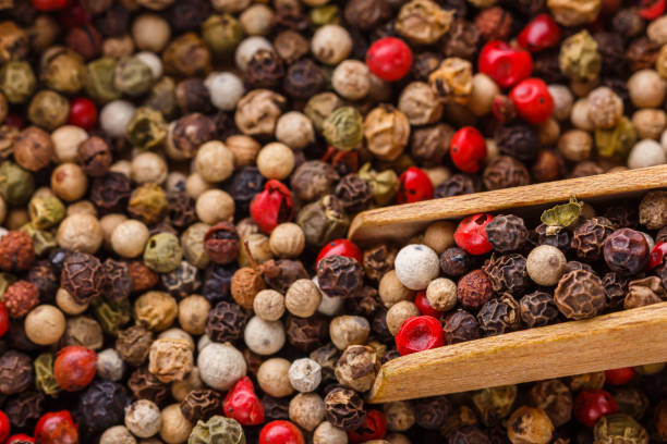 istock mix of peppercorns on white acrylic background 1211321430