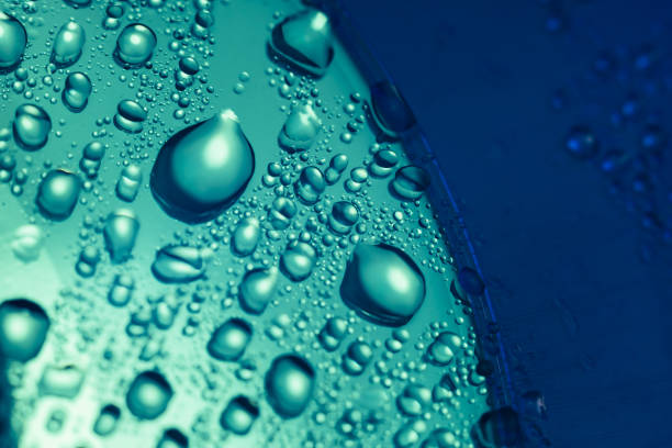 istock Close up beautiful colored water drops on a cd disk background. 1211321965
