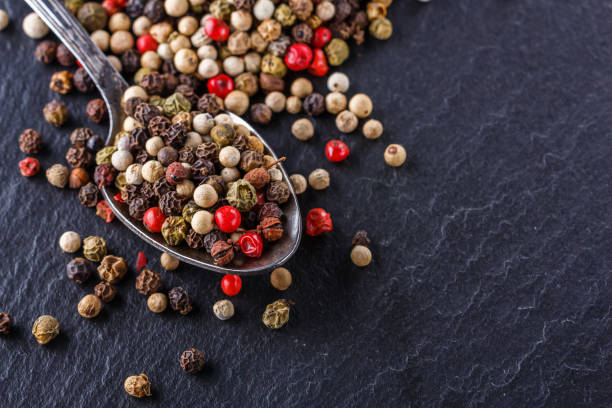 istock mix of peppercorns on a dark stone background 1211322025