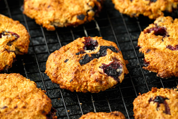 istock Home made Blueberry and walnut oat cookies on black background 1211322671