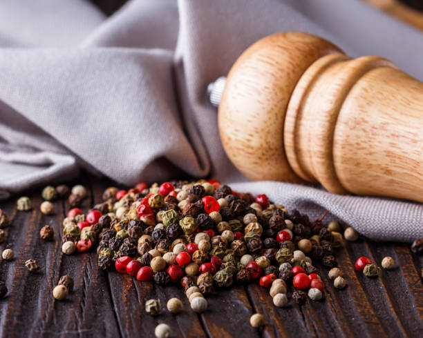 istock mix of peppercorns on a dark wooden rustic background 1211322706