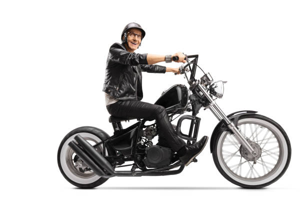 istock Elderly man riding a customized chopper motorbike 1211323163