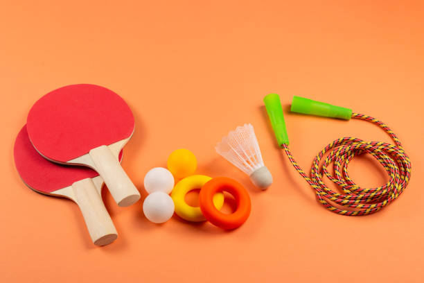 istock Sport equipment on orange background. 1211324146