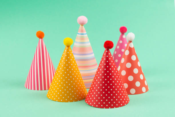 istock Colorful birthday caps on mint background. 1211324329
