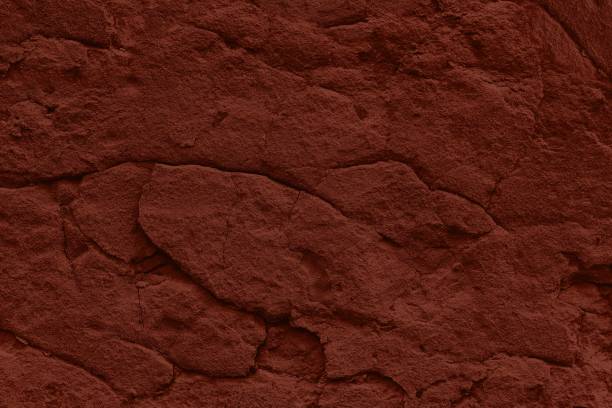 terracotta shabby stucco background with cracks