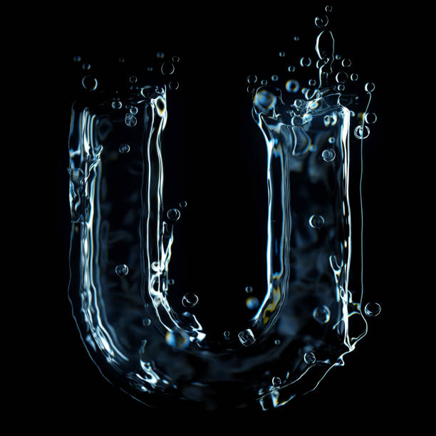 istock Liquid letter U water splash isolated on black background 1211325897