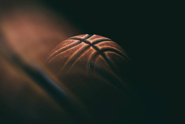 istock basketball ball on black background. 1211326146
