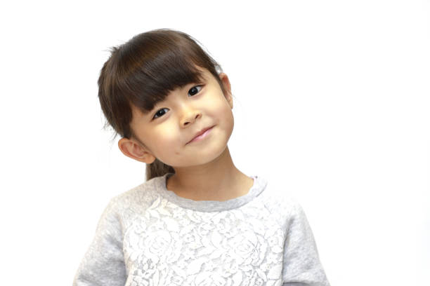 istock smiling Japanese girl (5 years old) (white back) 1211326163