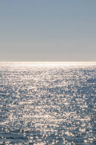 istock seascape, sun lights and skyline 1211327561