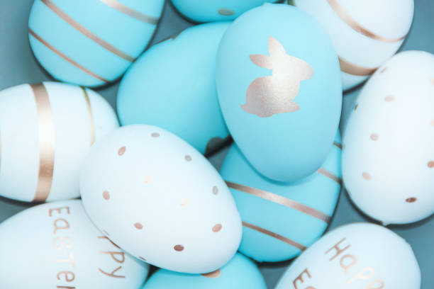 istock Easter background with Easter eggs in bird nest on blue background 1211332681