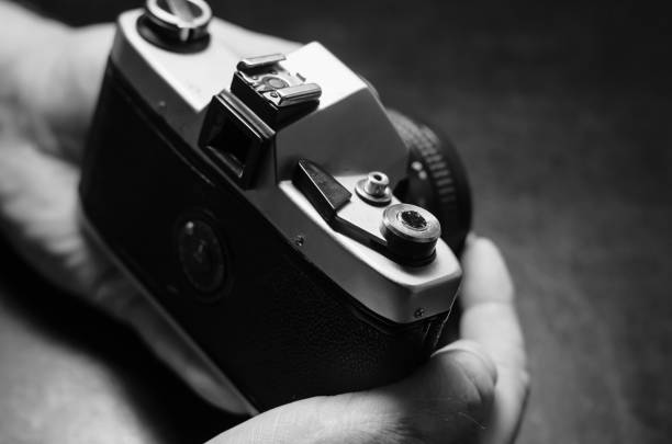istock Hands are holding a metal camera. 1211336925