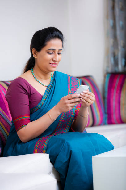 istock Woman Sitting On Sofa stock photo 1211337880