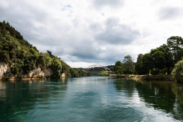 Waikato River passing East Taupo Arterial bridge the calm water of Waikato River passing by East Taupo Arterial bridge waikato region stock pictures, royalty-free photos & images
