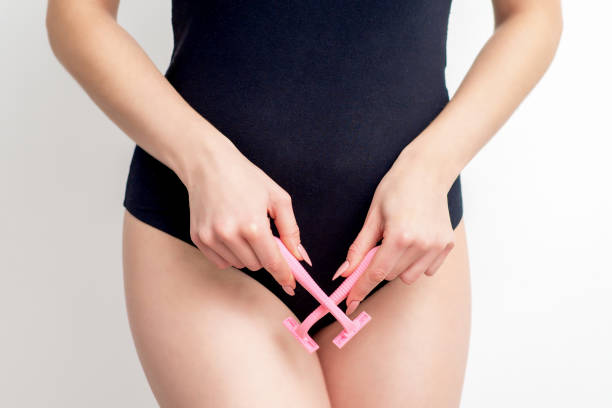 istock Female holds razors on bikini area. 1211339951