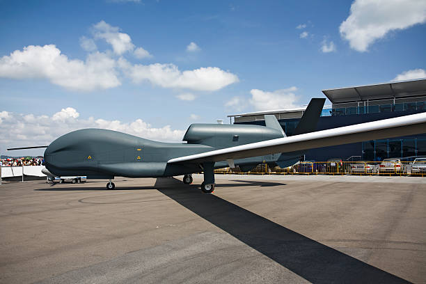 A cool Global Hawk unmanned aerial vehicle on the airfield with the blue sky.