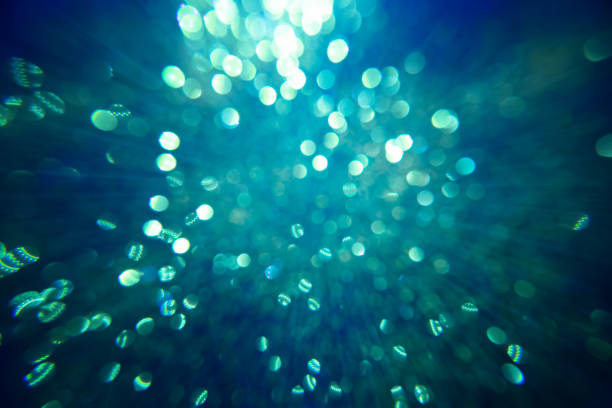 istock Blue sparkling glitter bokeh background with light. 1211340654