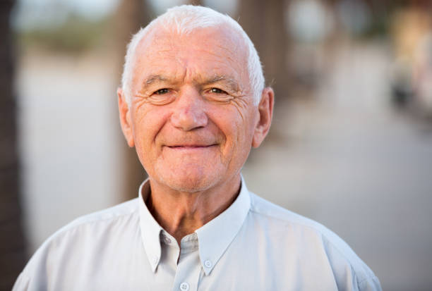 istock positive mature man in the park 1211341366