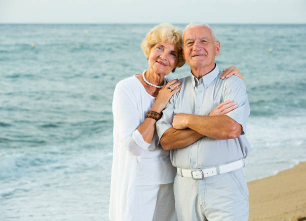 istock mature female and male standing 1211341369