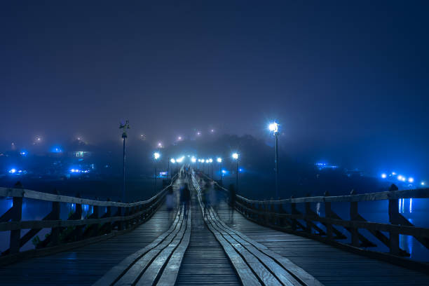 Long exposure with Motion people on Mon bridge in the night at Sangkhla Buri Long exposure with Motion people on Mon bridge in the night at Sangkhla Buri, Kanchanaburi province, Travel of Thailand. sangkhla stock pictures, royalty-free photos & images