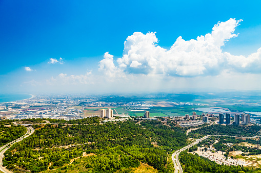 Panoramic view of the bay of Haifa, with downtown Haifa, the harbor, the industrial zone in a sunny summer day. Viewed from Haifa University. Haifa, Northern Israel
