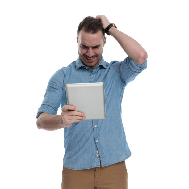 istock Crying casual man looking at table with hand on head 1211343272