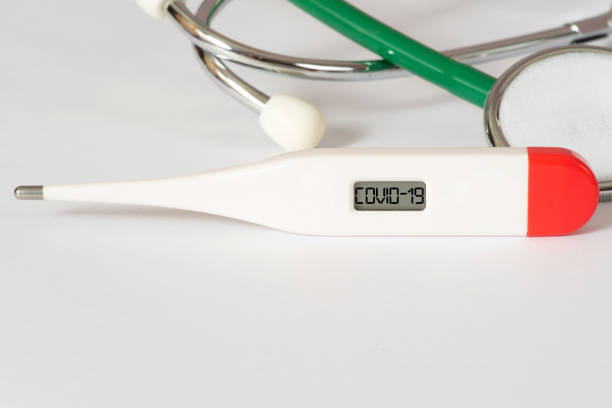 istock One thermometer, stethoscope and Covid-19 coronavirus 1211343339