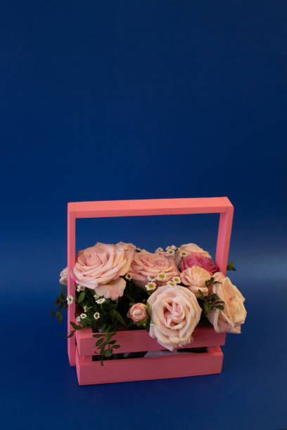 postcard template, copy Space - a basket of flowers with pink roses on a blue background postcard template, copy Space - a basket of flowers with pink roses on a blue background valentinstag stock pictures, royalty-free photos & images