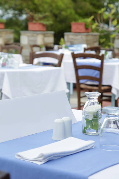 istock The charming retro Mediterranean outdoor restaurant, no people, empty seats and tables before dinner time 1211343744