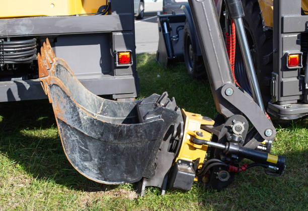 istock Swivel, modern hydraulic excavator bucket for soil loading, industry, equipment 1211344506