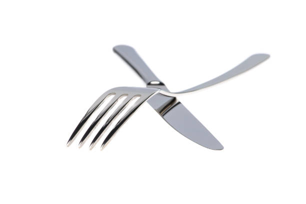 istock Set of fork, knife and spoons isolated on white. 1211344707