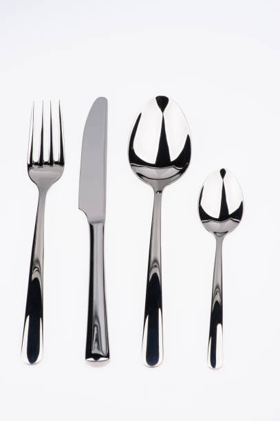 istock Set of fork, knife and spoons isolated on white. 1211344822