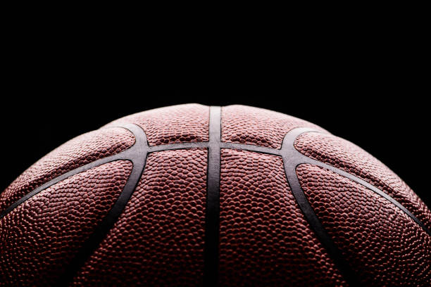 istock basketball ball on black background. 1211344824