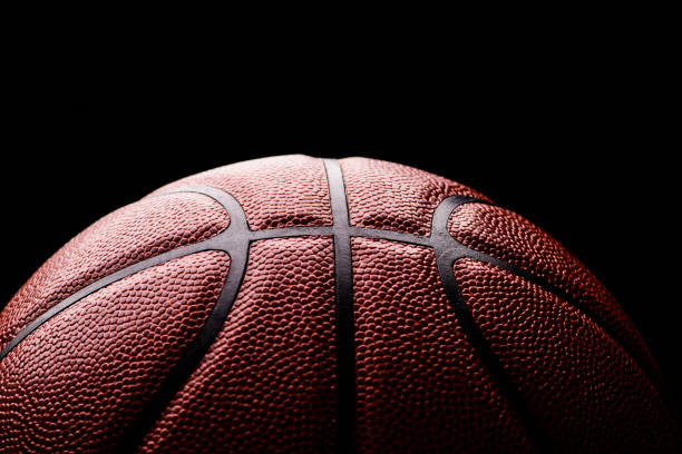 istock basketball ball on black background. 1211344861
