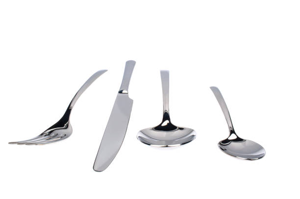 istock Set of fork, knife and spoons isolated on white. 1211344862