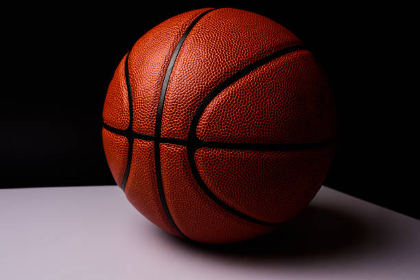 istock basketball ball on black background. 1211344886