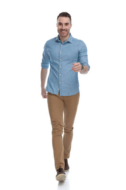istock Cheerful casual man smiling while wearing blue shirt 1211345100