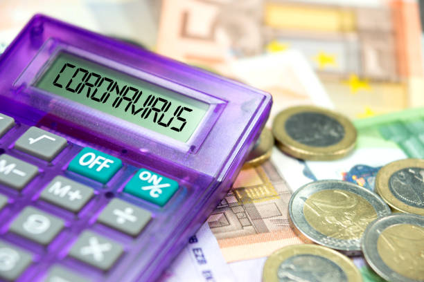 Calculator, Euro banknotes and coronavirus in Europe Calculator, Euro Banknotes and Coronavirus in Europe europa mythological character photos stock pictures, royalty-free photos & images