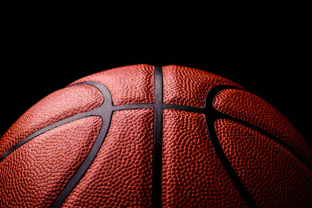 istock basketball ball on black background. 1211345182