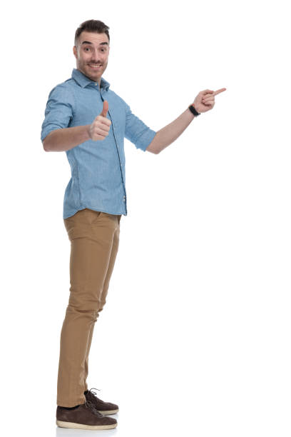 istock Side view of cheerful casual man pointing and gesturing ok 1211345401
