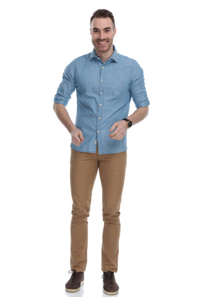 istock Cheerful casual man laughing while wearing blue shirt 1211346249