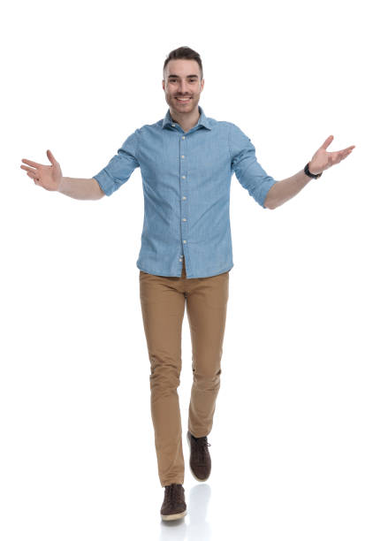 istock Cheerful casual man smiling and welcoming 1211346392